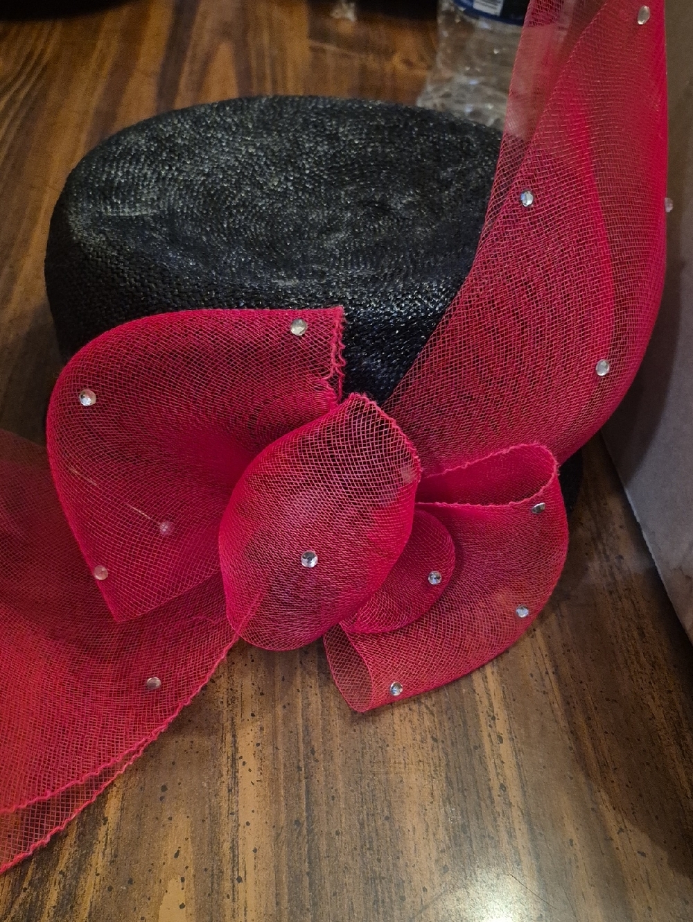 Black Pillbox Hat with Red Mesh Bow and Rhinestone Accents